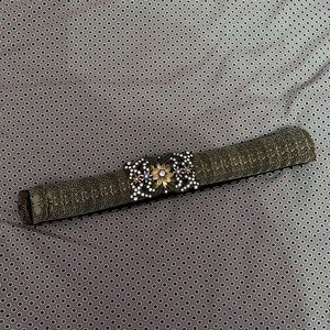 Gold belt with brooch